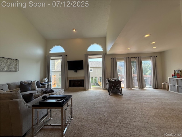 4178 Breckenridge Dr, West Bloomfield, MI 48322 - carpeted living area with high vaulted ceiling, a fireplace, and recessed lighting