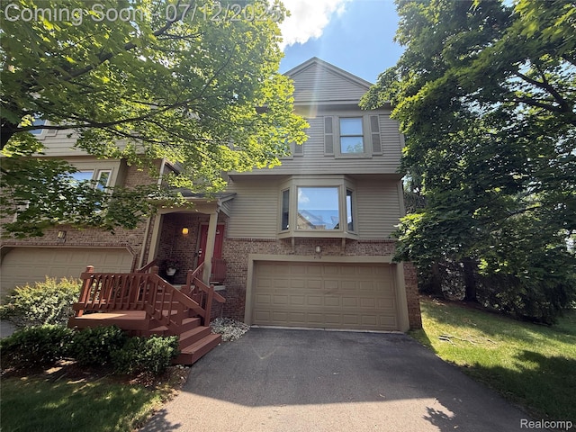 4178 Breckenridge Dr, West Bloomfield, MI 48322 - view of front of house with an attached garage, brick siding, and driveway