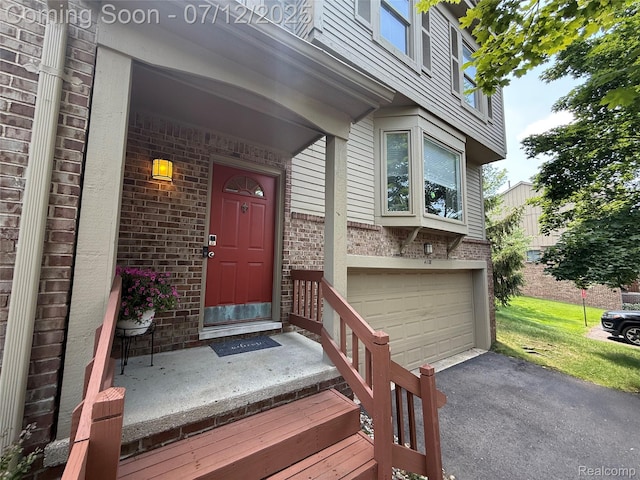4178 Breckenridge Dr, West Bloomfield, MI 48322 - doorway to property with brick siding, an attached garage, and asphalt driveway