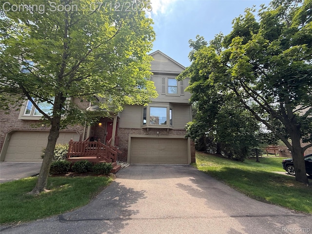 4178 Breckenridge Dr, West Bloomfield, MI 48322 - view of front of house featuring brick siding, a garage, asphalt driveway, and a front yard