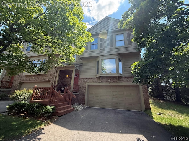 4178 Breckenridge Dr, West Bloomfield, MI 48322 - view of front of house featuring a garage, driveway, and brick siding