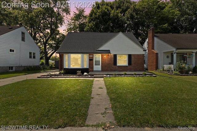23041 Shakespeare Ave, Eastpointe, MI 48021 - view of front of house featuring brick siding and a lawn