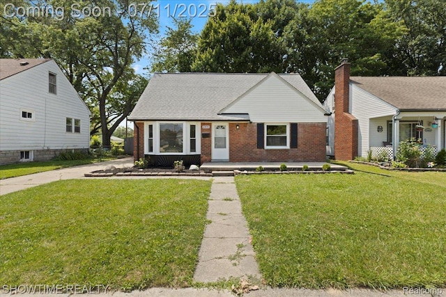 23041 Shakespeare Ave, Eastpointe, MI 48021 - view of front facade featuring brick siding and a front yard