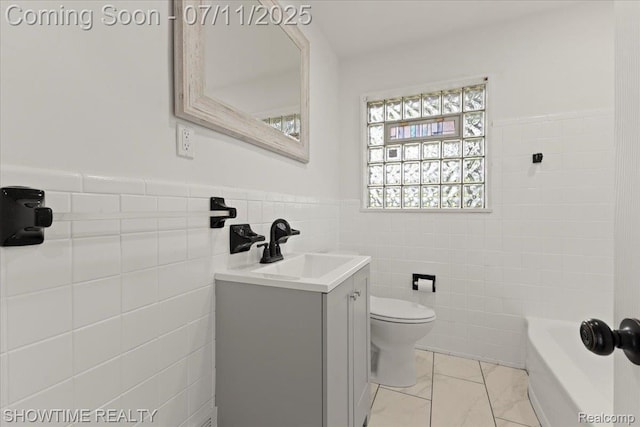 23041 Shakespeare Ave, Eastpointe, MI 48021 - bathroom with tile walls, vanity, wainscoting, a tub to relax in, and marble look tile flooring