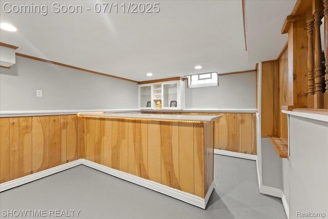 23041 Shakespeare Ave, Eastpointe, MI 48021 - kitchen with finished concrete floors, wainscoting, recessed lighting, light countertops, and wood walls