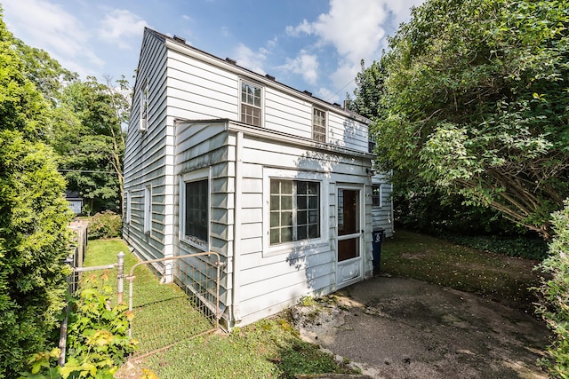 303 Wesley St, Ann Arbor, MI 48103 - view of home's exterior with a yard