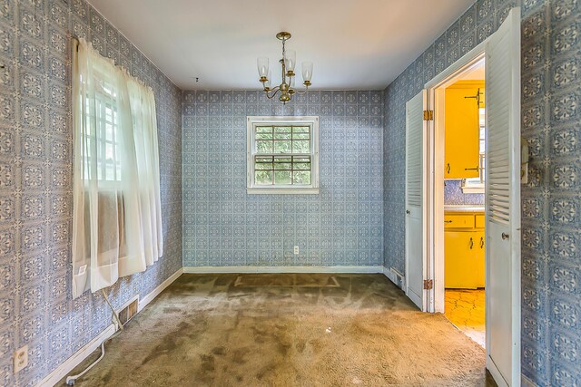 303 Wesley St, Ann Arbor, MI 48103 - unfurnished dining area with a chandelier, carpet flooring, and wallpapered walls