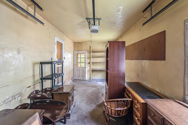 303 Wesley St, Ann Arbor, MI 48103 - miscellaneous room featuring unfinished concrete floors and a garage