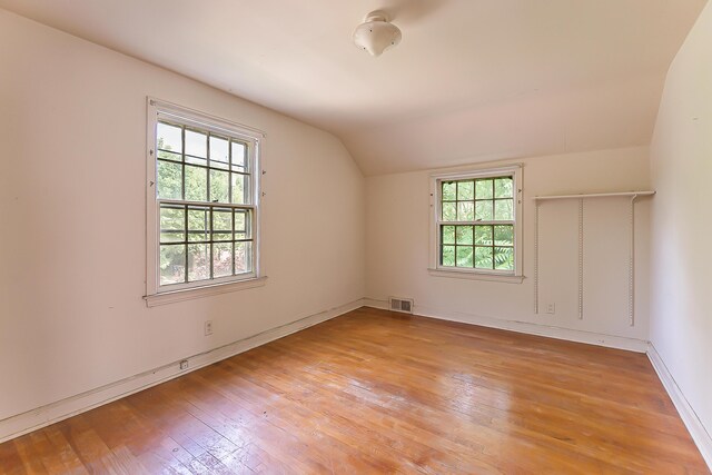 303 Wesley St, Ann Arbor, MI 48103 - empty room featuring lofted ceiling, plenty of natural light, and light wood-style flooring
