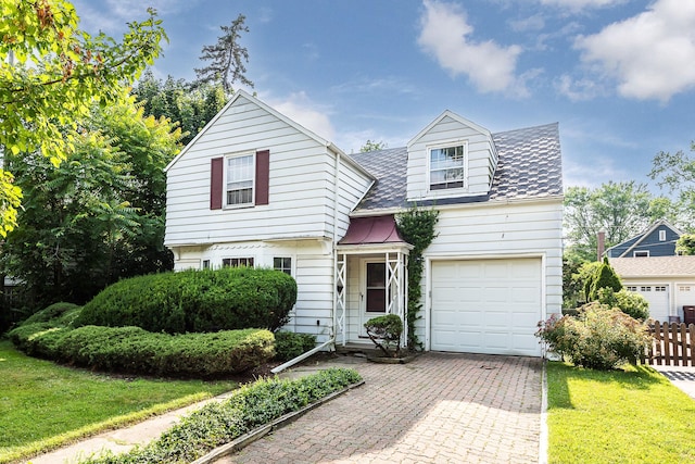 303 Wesley St, Ann Arbor, MI 48103 - view of front of home featuring decorative driveway and a garage