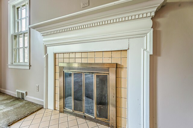 303 Wesley St, Ann Arbor, MI 48103 - detailed view of a tile fireplace and baseboards