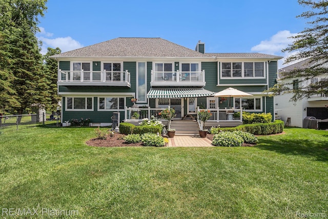 16344 Waterview Ln, Linden, MI 48451 - rear view of house featuring a chimney and a deck