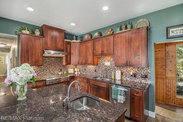 16344 Waterview Ln, Linden, MI 48451 - kitchen with stainless steel appliances, extractor fan, tasteful backsplash, dark stone counters, and recessed lighting