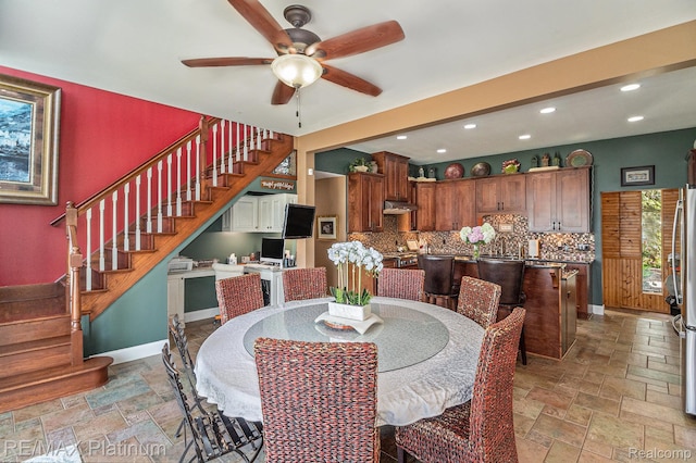16344 Waterview Ln, Linden, MI 48451 - dining area featuring stone tile flooring, stairway, ceiling fan, and recessed lighting