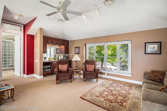 16344 Waterview Ln, Linden, MI 48451 - living room with vaulted ceiling, light carpet, ceiling fan, and rail lighting