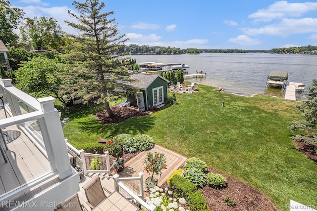 16344 Waterview Ln, Linden, MI 48451 - view of green lawn featuring a water view, a boat dock, and boat lift