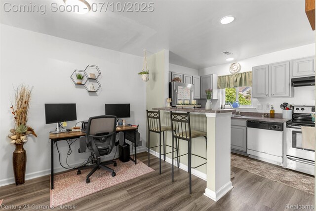 23486 Boller Ct, Trenton, MI 48183 - home office with wood finished floors and recessed lighting