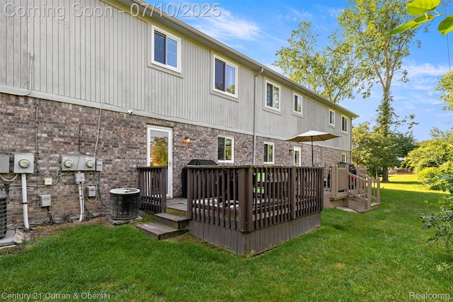 23486 Boller Ct, Trenton, MI 48183 - rear view of house featuring a yard, a wooden deck, and brick siding