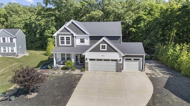 18734 Leonard Ct, New Buffalo, MI 49117 - view of front facade featuring a porch, driveway, stone siding, a garage, and a shingled roof