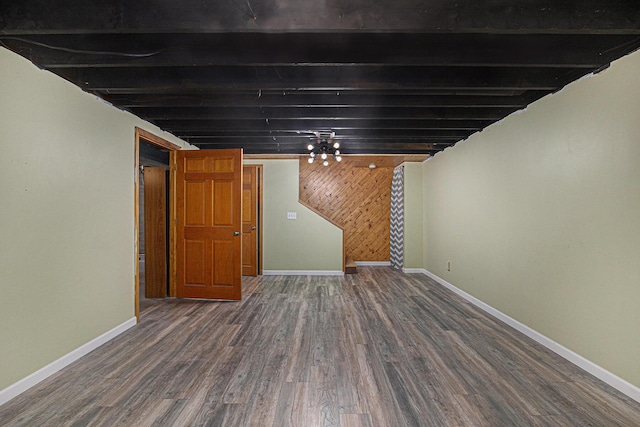 19160 Glendale Cir, Spring Lake, MI 49456 - below grade area with dark wood-style flooring and wood walls