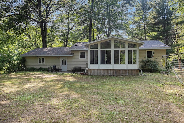 19160 Glendale Cir, Spring Lake, MI 49456 - back of house with a lawn and a sunroom