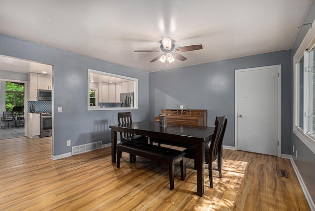 19160 Glendale Cir, Spring Lake, MI 49456 - dining room featuring ceiling fan and light wood finished floors