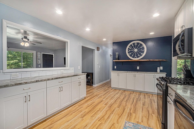 19160 Glendale Cir, Spring Lake, MI 49456 - kitchen featuring appliances with stainless steel finishes, light wood finished floors, white cabinetry, and recessed lighting