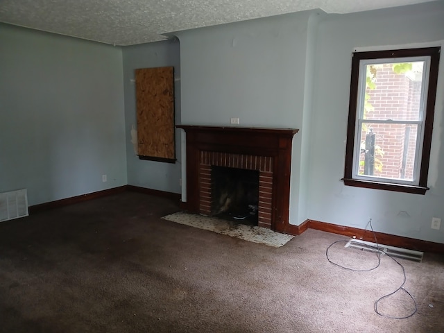 9729 Lakepointe St, Detroit, MI 48224 - unfurnished living room with carpet flooring, a brick fireplace, and a textured ceiling