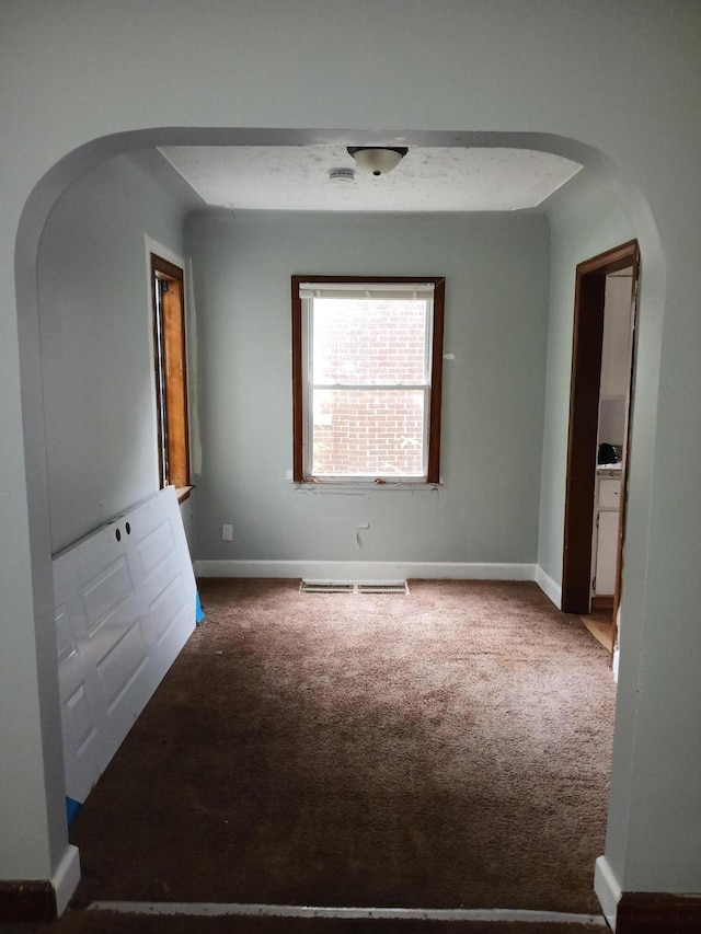 9729 Lakepointe St, Detroit, MI 48224 - empty room with arched walkways and carpet
