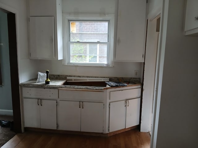9729 Lakepointe St, Detroit, MI 48224 - kitchen with white cabinets and wood finished floors