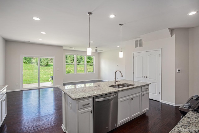24727 Ivy Ln, Novi, MI 48375 - kitchen featuring stainless steel dishwasher, healthy amount of natural light, dark wood-type flooring, recessed lighting, and light stone countertops