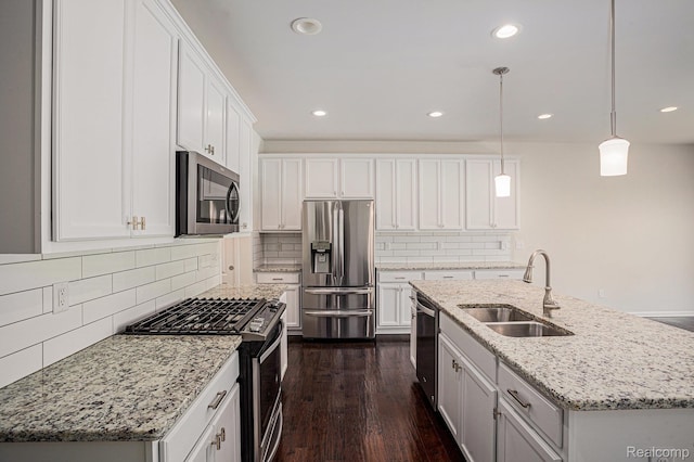 24727 Ivy Ln, Novi, MI 48375 - kitchen with stainless steel appliances, dark wood-style floors, white cabinets, tasteful backsplash, and recessed lighting