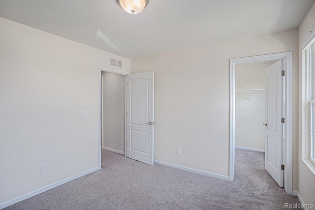 24727 Ivy Ln, Novi, MI 48375 - unfurnished bedroom featuring carpet and a spacious closet