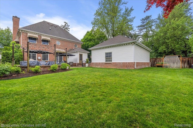 364 Chesterfield Ave, Birmingham, MI 48009 - rear view of house featuring a chimney and brick siding