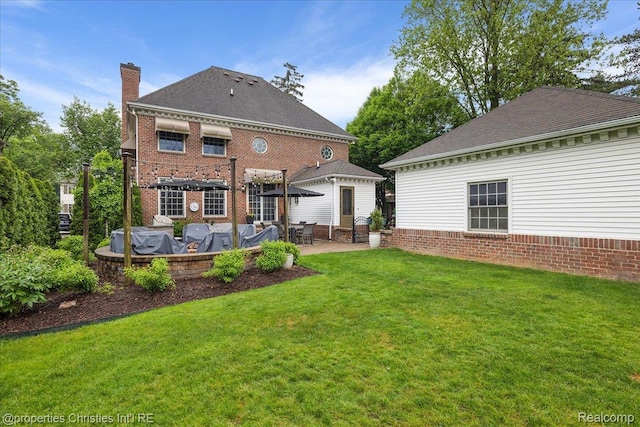 364 Chesterfield Ave, Birmingham, MI 48009 - rear view of property with a lawn, a patio, a chimney, and roof with shingles