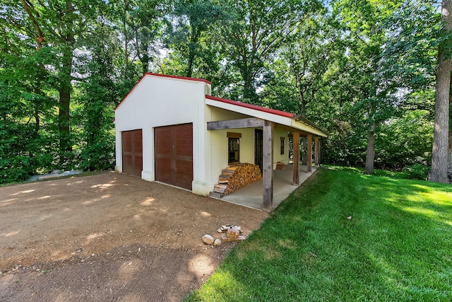 3420 Grange Rd, Berrien Springs, MI 49103 - view of side of property with a lawn and a detached garage