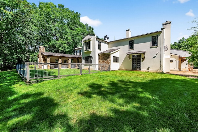 3420 Grange Rd, Berrien Springs, MI 49103 - back of house with stucco siding, a chimney, and french doors