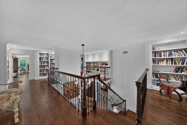 3420 Grange Rd, Berrien Springs, MI 49103 - corridor featuring an upstairs landing, built in features, crown molding, wood finished floors, and recessed lighting