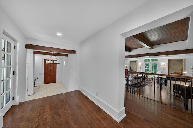 3420 Grange Rd, Berrien Springs, MI 49103 - corridor featuring wood finished floors, beam ceiling, an upstairs landing, recessed lighting, and a chandelier