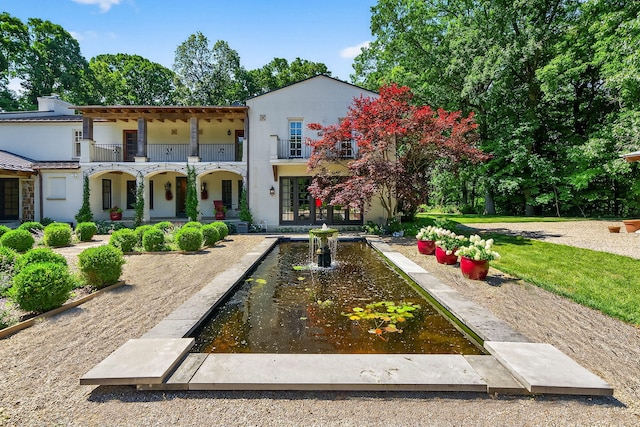 3420 Grange Rd, Berrien Springs, MI 49103 - mediterranean / spanish house with a balcony and stucco siding