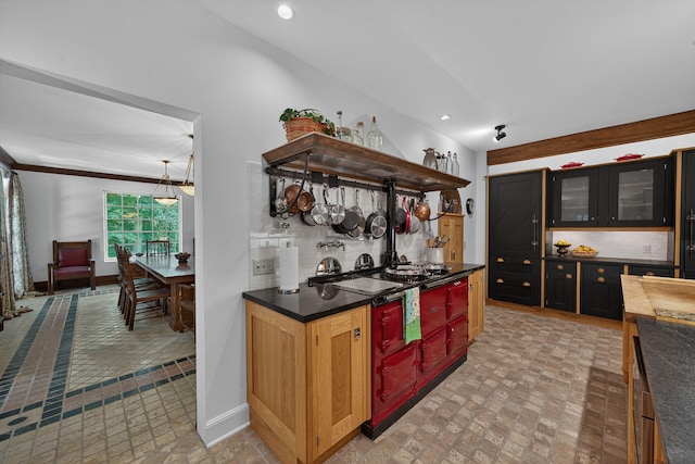 3420 Grange Rd, Berrien Springs, MI 49103 - kitchen featuring backsplash, recessed lighting, dark countertops, glass insert cabinets, and open shelves