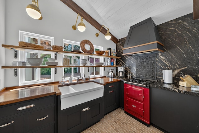 3420 Grange Rd, Berrien Springs, MI 49103 - kitchen featuring range hood, open shelves, backsplash, gas cooktop, and brick patterned flooring