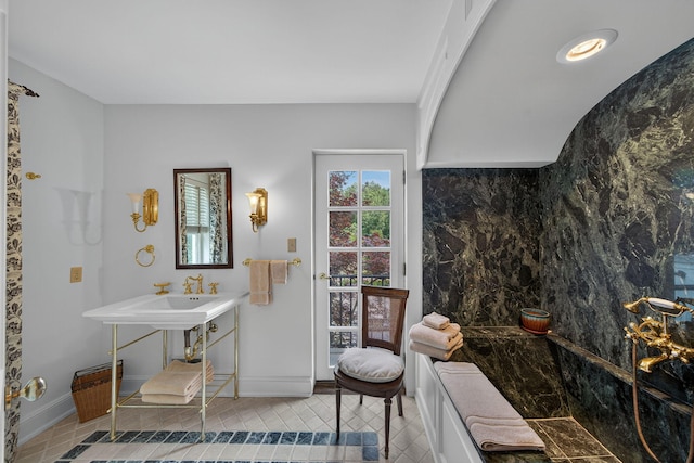 3420 Grange Rd, Berrien Springs, MI 49103 - bathroom with tile patterned flooring and a tub with marble appearance