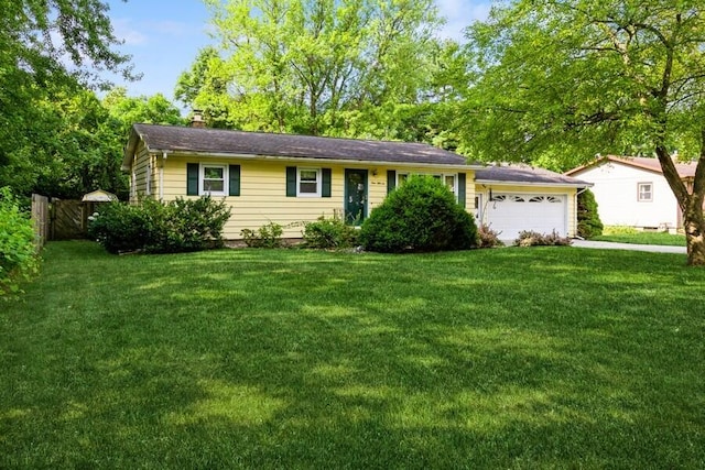 956 Vinewood Dr, Saint Joseph, MI 49085 - ranch-style home featuring an attached garage, a chimney, and driveway