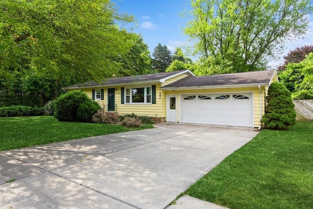 956 Vinewood Dr, Saint Joseph, MI 49085 - ranch-style home featuring driveway, an attached garage, and a front yard