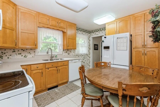 956 Vinewood Dr, Saint Joseph, MI 49085 - kitchen with white appliances, wallpapered walls, light tile patterned flooring, and light countertops