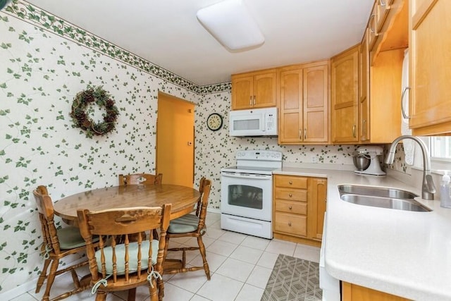 956 Vinewood Dr, Saint Joseph, MI 49085 - kitchen with white appliances, wallpapered walls, light countertops, and light tile patterned floors
