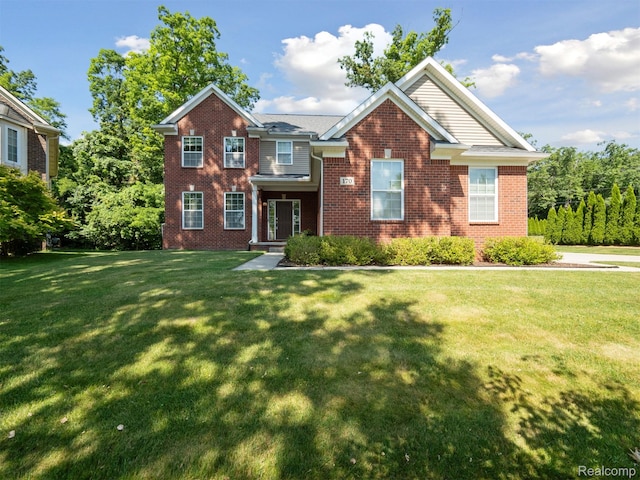170 W Reed Lake Ct, Commerce Twp, MI 48390 - view of front facade featuring brick siding and a front yard