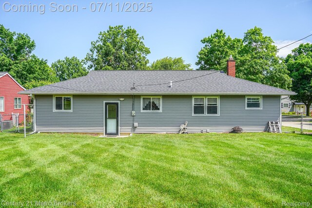 338 N Dr, Davison, MI 48423 - rear view of property featuring a chimney and roof with shingles