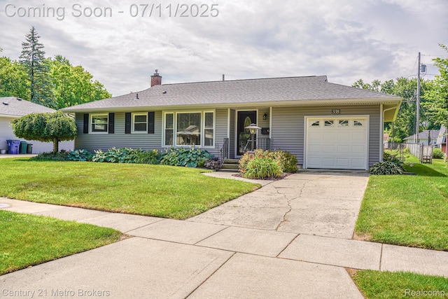 338 N Dr, Davison, MI 48423 - ranch-style home featuring an attached garage, concrete driveway, a chimney, and a front yard